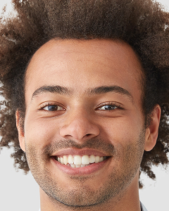 mixed race curly male with broad smile shows perf 2025 01 24 03 08 13 utc 1